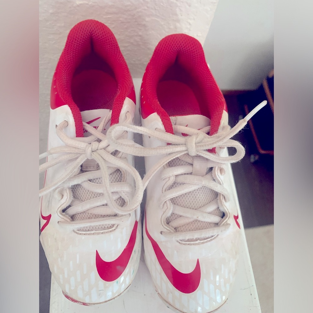 Size 13 Nike softball cleats,colors red and white.  Smoke and pet free home.